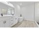 Spa-like bathroom featuring a freestanding tub and double vanity at 16895 Sw 50Th Cir, Ocala, FL 34473