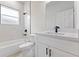 Updated bathroom with white vanity, quartz countertop, and black matte fixtures at 16895 Sw 50Th Cir, Ocala, FL 34473