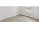 Simple bedroom with window and wood-look floors at 16895 Sw 50Th Cir, Ocala, FL 34473