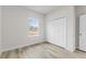 Bedroom with closet and window overlooking yard at 16895 Sw 50Th Cir, Ocala, FL 34473