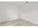 Spacious bedroom with wood-look floors and neutral walls at 16895 Sw 50Th Cir, Ocala, FL 34473