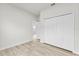 Bedroom with double-door closet and wood-look floors at 16895 Sw 50Th Cir, Ocala, FL 34473