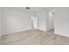 Bedroom with wood floors and access to other rooms at 16895 Sw 50Th Cir, Ocala, FL 34473