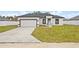Newly constructed home with attached garage and spacious lawn at 16895 Sw 50Th Cir, Ocala, FL 34473