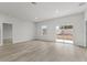 Bright living room with sliding glass doors and wood-look floors at 16895 Sw 50Th Cir, Ocala, FL 34473