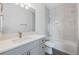 Modern bathroom with gray vanity and marble shower/tub combo at 1707 Merthie Dr, Sanford, FL 32771