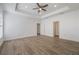 Spacious bedroom with wood-look flooring and ceiling fan at 1707 Merthie Dr, Sanford, FL 32771