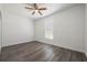 Simple bedroom with wood-look flooring and ceiling fan at 1707 Merthie Dr, Sanford, FL 32771