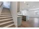 Modern staircase with gray wood-look treads at 1707 Merthie Dr, Sanford, FL 32771