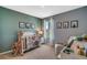 Bedroom with a crib, giraffe toy, and animal-themed decor at 1711 Three Bars Rd, Kissimmee, FL 34744