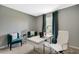 Bright home office featuring a white desk and comfortable seating at 1711 Three Bars Rd, Kissimmee, FL 34744