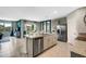 Open kitchen with stainless steel appliances and granite countertops at 1711 Three Bars Rd, Kissimmee, FL 34744