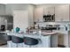 Modern kitchen with island and stainless steel appliances at 1711 Three Bars Rd, Kissimmee, FL 34744