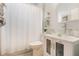 Clean bathroom with glass vessel sink, white vanity, and shower/tub combo at 1809 Silver Valley Ct, Apopka, FL 32712