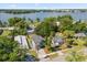 Aerial view of home near lake, with lush greenery and mature trees at 1875 Staunton Ave, Winter Park, FL 32789