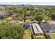 Charming neighborhood featuring lush trees and a mix of cozy homes with downtown skyline view in the distance at 1875 Staunton Ave, Winter Park, FL 32789