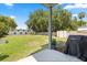 Backyard featuring a green lawn, privacy fence, storage shed, and Weber grill at 1875 Staunton Ave, Winter Park, FL 32789