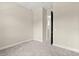 Neutral bedroom features light gray carpet, white trim, and a walk-in closet at 1875 Staunton Ave, Winter Park, FL 32789