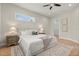 Bedroom with light colored wood floors, rug, ceiling fan, and a door to the walk-in closet at 1875 Staunton Ave, Winter Park, FL 32789