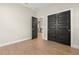 Spacious bedroom featuring wood-look floors, neutral paint, and closet doors at 1875 Staunton Ave, Winter Park, FL 32789