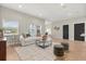 Bright living room with hardwood floors, a white sofa, a modern coffee table, and recessed lighting at 1875 Staunton Ave, Winter Park, FL 32789
