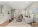Bright living room with hardwood floors, recessed lighting, and a comfortable white sofa arrangement at 1875 Staunton Ave, Winter Park, FL 32789