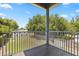 Screened-in porch with dark wood-look tile floor, overlooking lush backyard at 1875 Staunton Ave, Winter Park, FL 32789