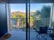 Balcony overlooking a tennis court and tropical landscaping at 1950 Summer Club Dr # 302, Oviedo, FL 32765