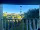 View from balcony showing tennis courts and trees at 1950 Summer Club Dr # 302, Oviedo, FL 32765