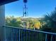 Relaxing balcony view overlooking lush landscaping and tennis courts at 1950 Summer Club Dr # 302, Oviedo, FL 32765