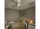 Bright bedroom featuring a double bed, ceiling fan, and window coverings at 1950 Summer Club Dr # 302, Oviedo, FL 32765