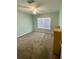 Spacious bedroom with neutral decor and a large window at 1950 Summer Club Dr # 302, Oviedo, FL 32765