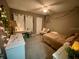 Cozy bedroom with a desk and comfortable seating area at 1950 Summer Club Dr # 302, Oviedo, FL 32765