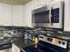 Stainless steel microwave and stove top at 1950 Summer Club Dr # 302, Oviedo, FL 32765