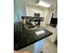 Modern kitchen with stainless steel appliances and dark countertops at 1950 Summer Club Dr # 302, Oviedo, FL 32765