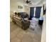 Living room with brown couches and a large TV at 1950 Summer Club Dr # 302, Oviedo, FL 32765