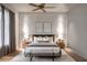 Spacious bedroom with neutral decor, wood floors, and ample natural light at 2011 University Dr, Orlando, FL 32804