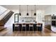 Modern kitchen with white cabinetry, marble countertops, and a large island at 2011 University Dr, Orlando, FL 32804