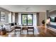 Bright and airy living room featuring a comfortable sectional sofa and large windows at 2011 University Dr, Orlando, FL 32804
