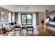 Bright living room boasts a large sliding door, hardwood floors, and contemporary design at 2011 University Dr, Orlando, FL 32804
