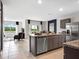 Modern kitchen with stainless steel appliances and granite countertops at 2118 Red Rock Rd, New Smyrna Beach, FL 32168