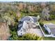 Aerial view of a two-story house with a large backyard and a spacious driveway at 2131 Dyan Way, Maitland, FL 32751