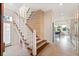 Modern staircase with wood and white accents at 2131 Dyan Way, Maitland, FL 32751