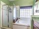 Bathroom featuring shower, separate tub, and window allowing natural light at 2132 Darlin Cir, Orlando, FL 32820