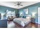 A Primary bedroom with hardwood floors, large window and comfortable queen sized bed at 2132 Darlin Cir, Orlando, FL 32820
