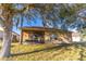House exterior showcasing a screened porch and tree-lined backyard at 2132 Darlin Cir, Orlando, FL 32820