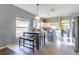 An open kitchen with stainless steel appliances, a cozy dining area, and a view into the living space at 2132 Darlin Cir, Orlando, FL 32820