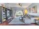 Open-concept living room with large windows, comfortable seating, and a view of the backyard at 2132 Darlin Cir, Orlando, FL 32820