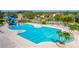 Resort-style pool with water slide, lap lanes, sundeck with chairs and umbrellas, and lush landscaping at 2132 Darlin Cir, Orlando, FL 32820