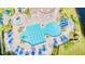 Aerial view of a large community pool with a slide, fountain, and lounging area at 2132 Darlin Cir, Orlando, FL 32820